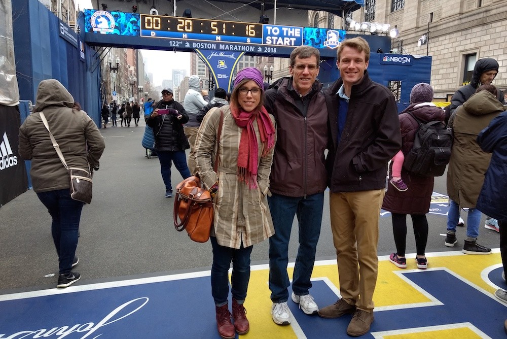 Brian Hammons, center, poses at the Boston Marathon finish line with his daughter April and son Adam.